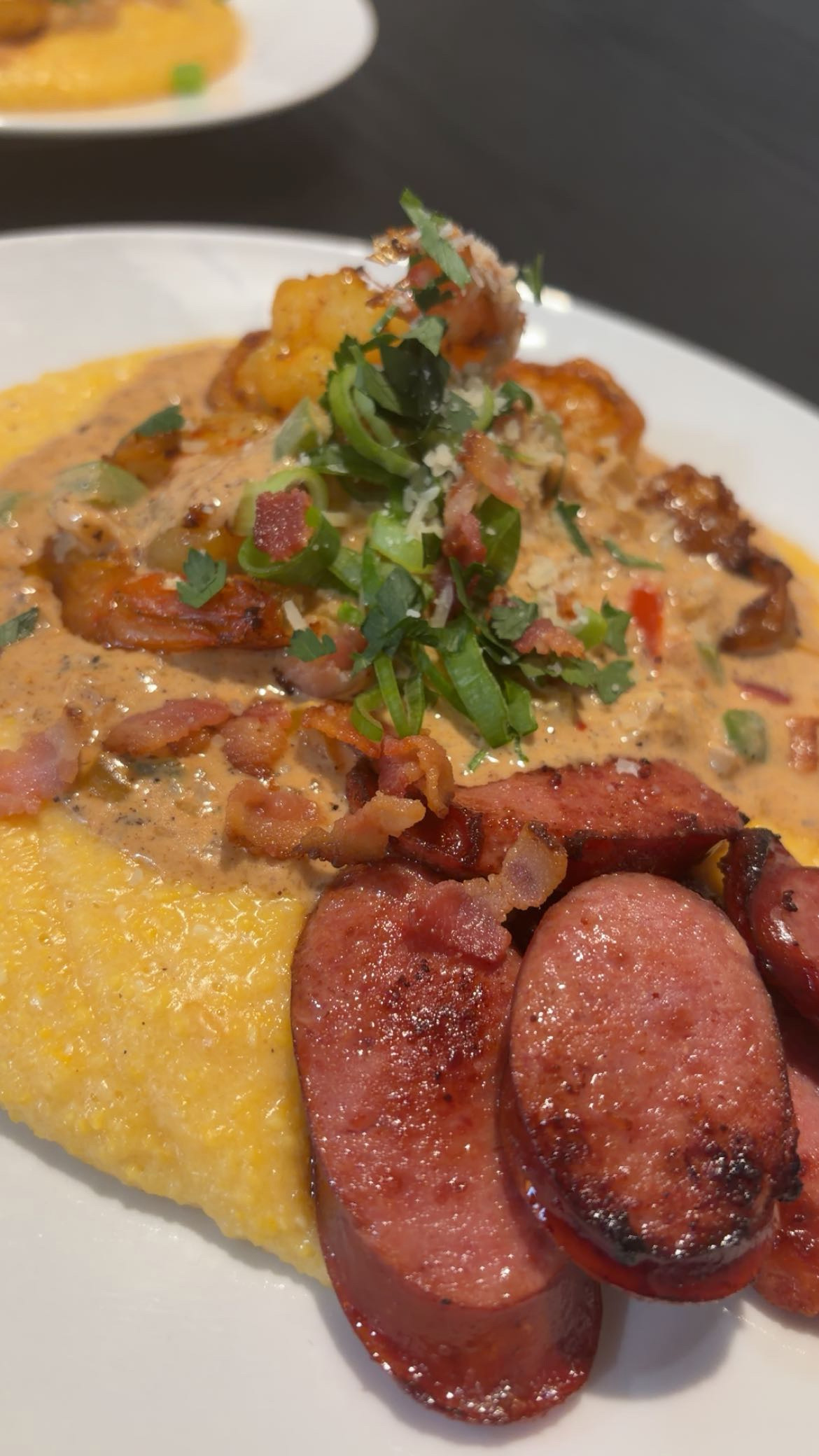Creamy grits with sausage and seafood